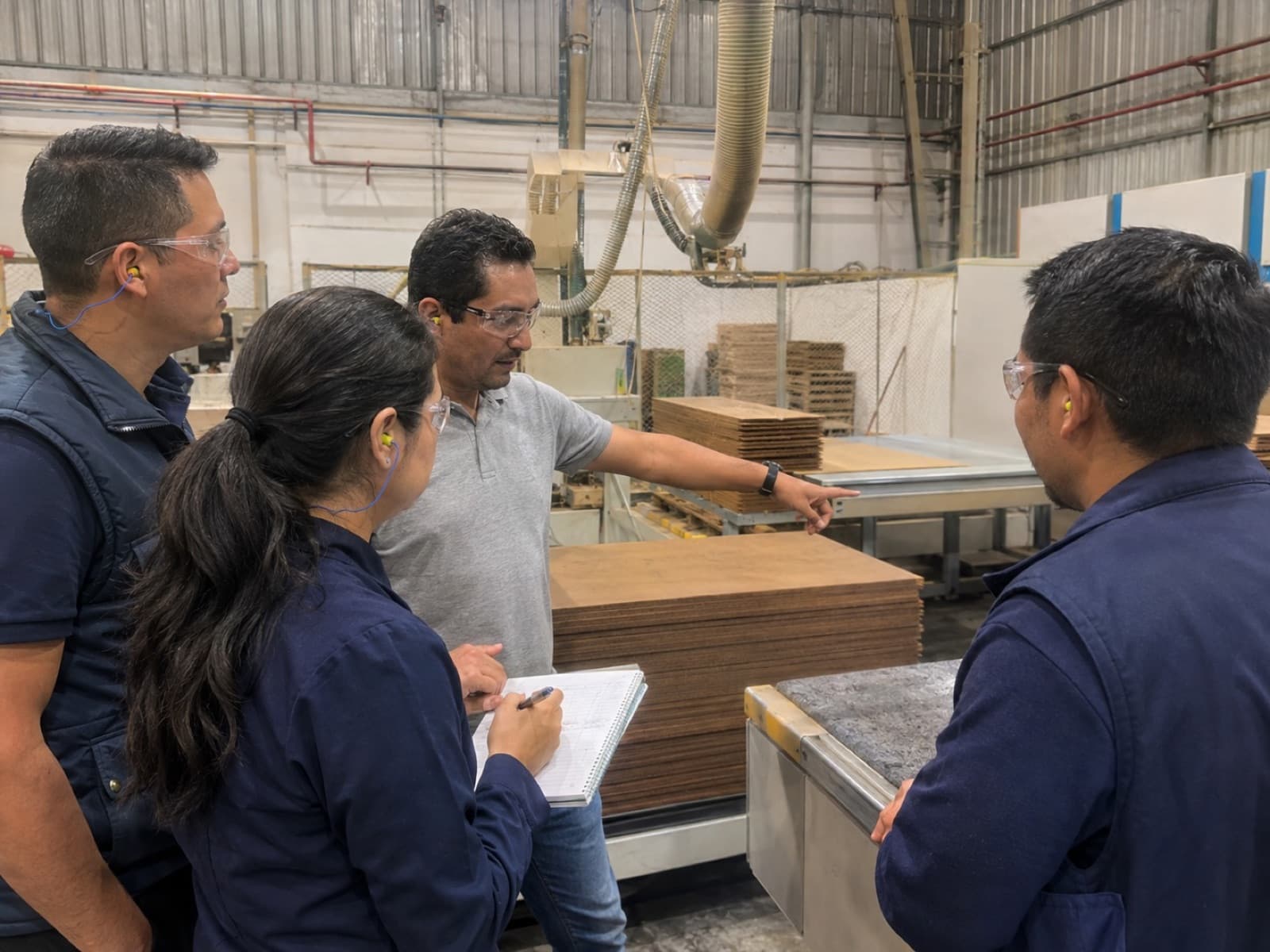 FractalWorks engineers reviewing production together on the plant floor